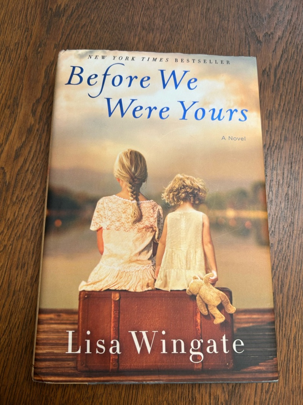 “Before We Were Yours” by Lisa Wingate. Beige/Blue Hardcover. Based on true life